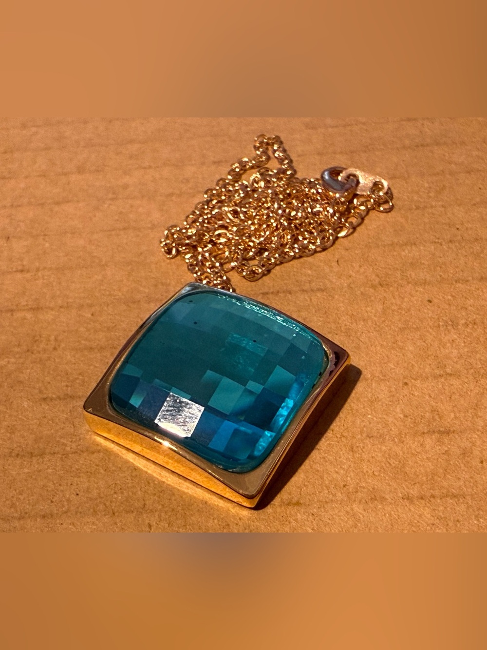 Gold tone Pendant Necklace with Large Blue Faceted Glass Stone